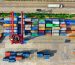 Colorful cargo containers organized at a shipping yard in North Jakarta, Indonesia.